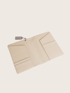 Beige textured leather notebook sleeve and Cover, Quran Sleeve and Cover, embossed geometric pattern and a silver metal logo tag with chain