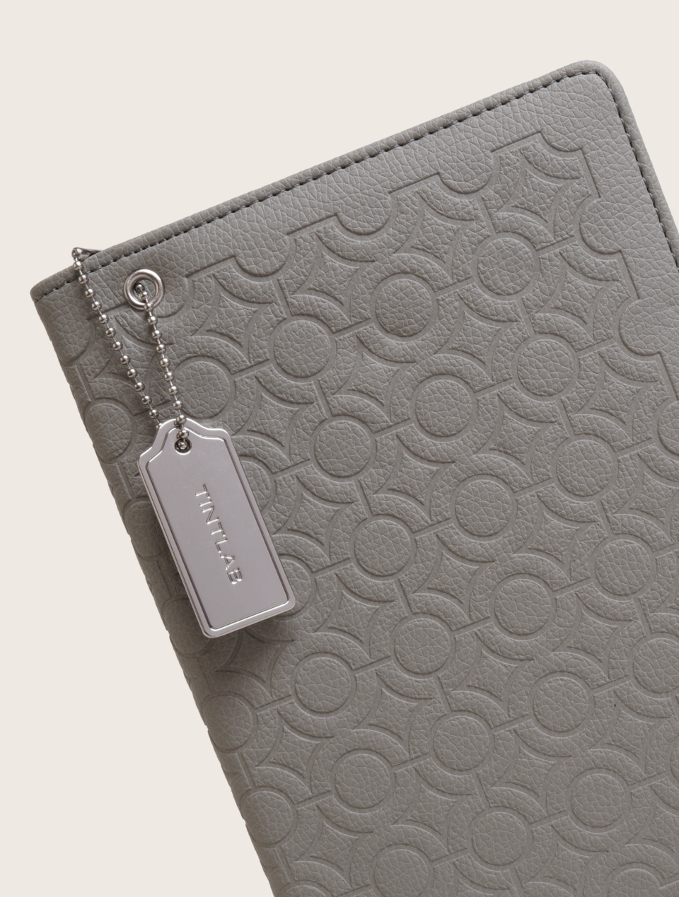 Grey textured leather notebook sleeve and Cover, Quran Sleeve and Cover, embossed geometric pattern and a silver metal logo tag with chain