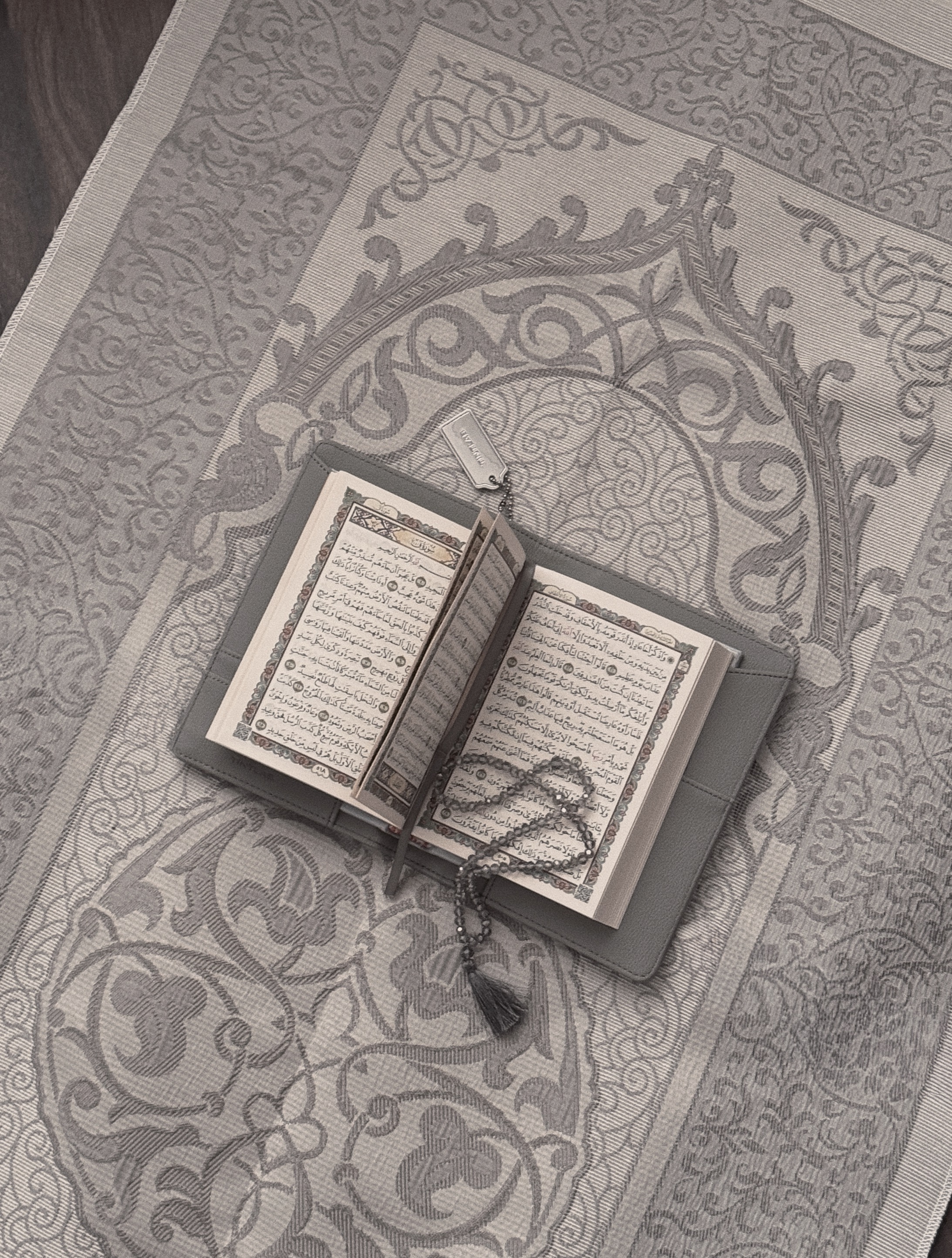 Grey textured leather notebook sleeve and Cover, Quran Sleeve and Cover, embossed geometric pattern and a silver metal logo tag with chain
