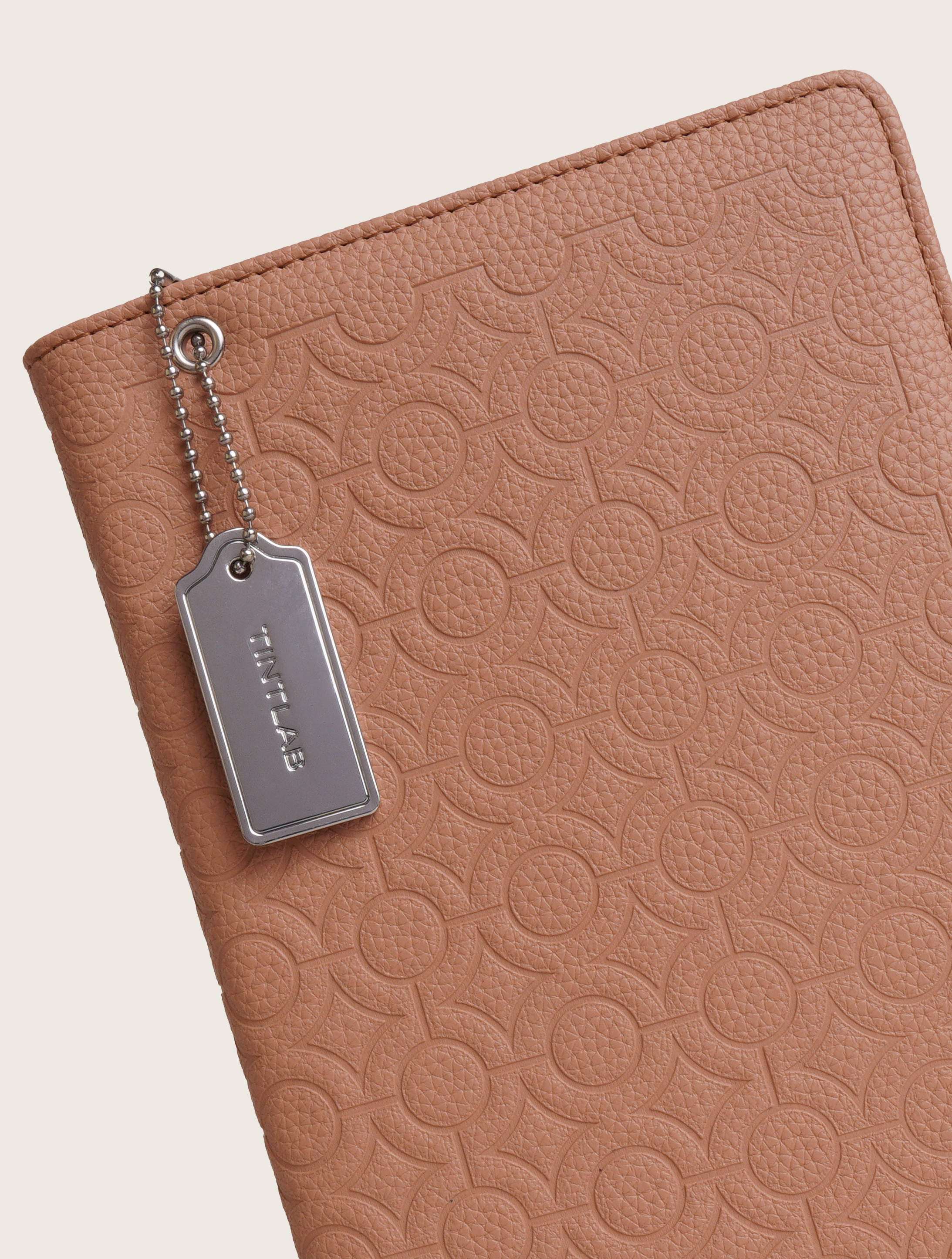 Clay brown textured leather notebook sleeve and Cover, Quran Sleeve and Cover, embossed geometric pattern and a silver metal logo tag with chain