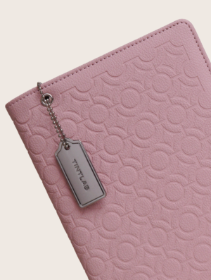 Pink textured leather notebook sleeve and Cover, Quran Sleeve and Cover, embossed geometric pattern and a silver metal logo tag with chain