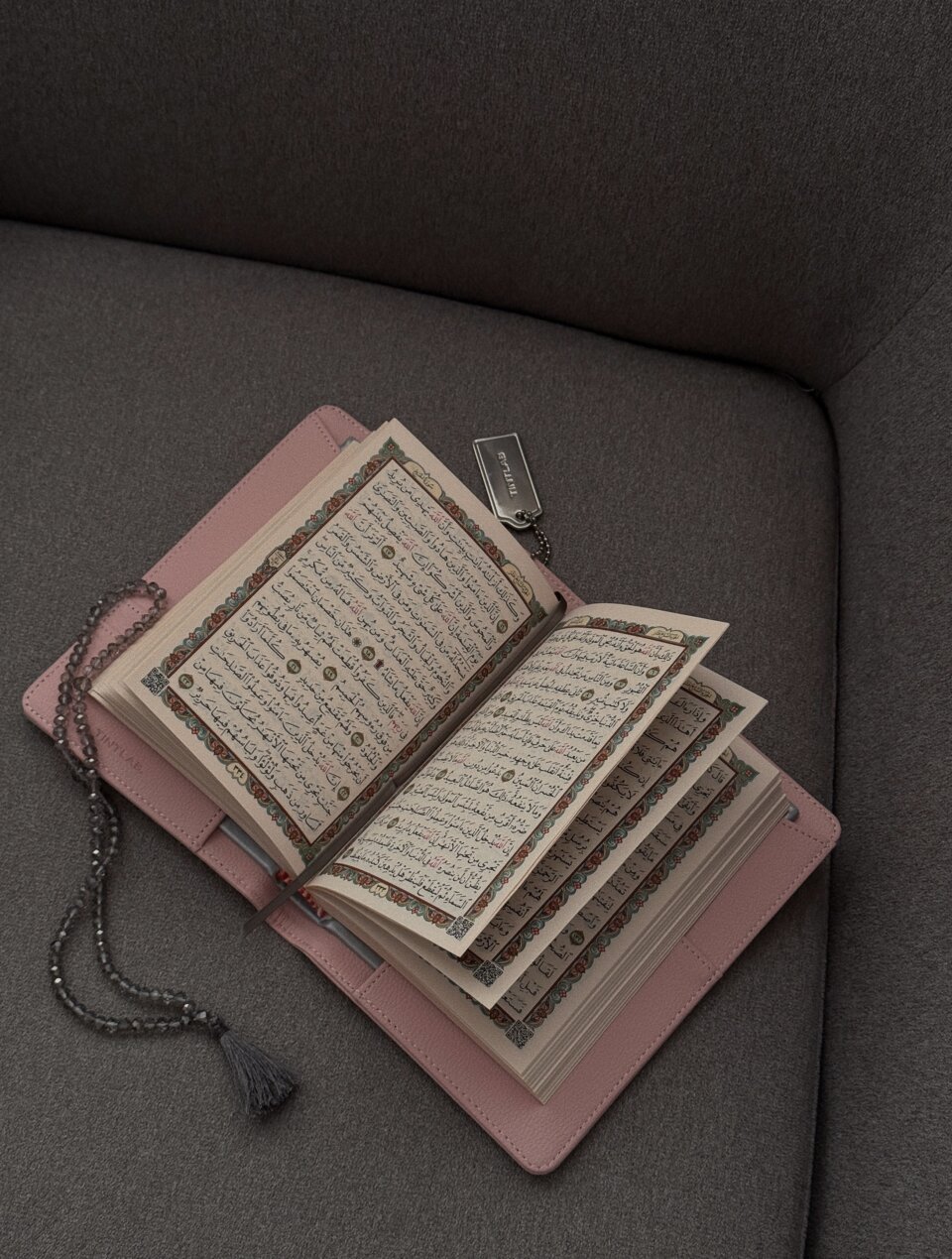 Pink textured leather notebook sleeve and Cover, Quran Sleeve and Cover, embossed geometric pattern and a silver metal logo tag with chain
